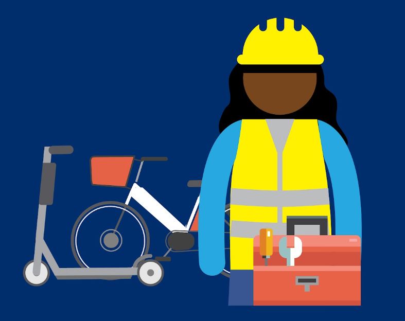 Worker wearing yellow hat with tool box